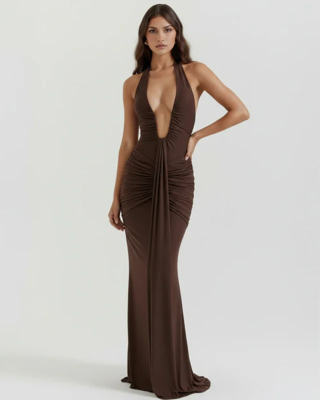 Full-length front view of the chocolate brown halter formal dress with a hand on the hip, showcasing the body-sculpting stretch fit and sophisticated monochromatic look.