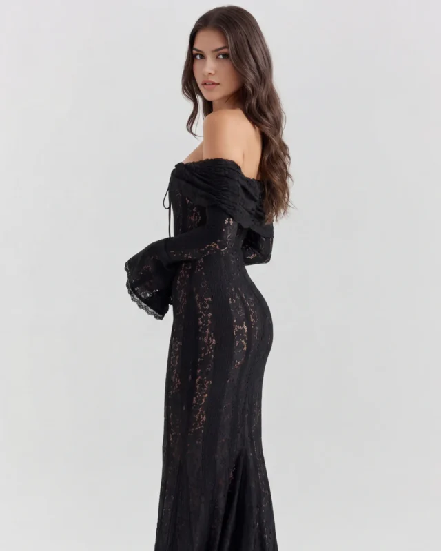 Three-quarter rear profile view of a black lace formal dress, showcasing the structured off-the-shoulder bardot neckline draped over the arms, the fitted body-con contouring, and long flared cuffs.