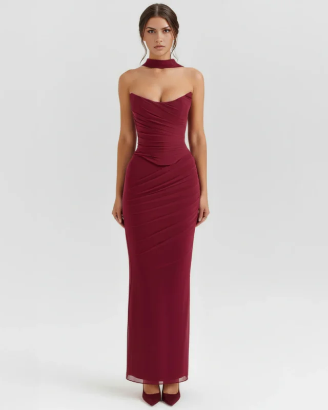 Front full-length portrait of the Victoria burgundy maxi gown, showcasing a strapless curved sweetheart neckline with fine ruching across the corseted mesh bodice, a matching wine-colored fabric neck choker, and a sleek column-style skirt.