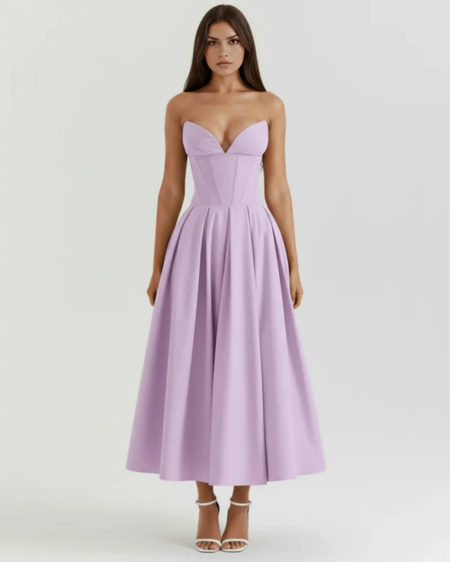 Direct front full-length studio shot of the lavender violet strapless evening gown, detailing the symmetrical boning panels along the cinched waist and the elegant flow of the tea-length skirt.