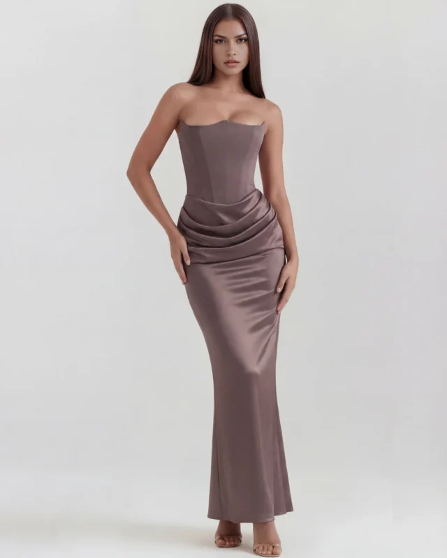 Front full-length perspective of a premium smoke grey strapless formal dress, showcasing the seamless curve-skimming fit, structural corset torso paneling, and an elegant floor-length column skirt.