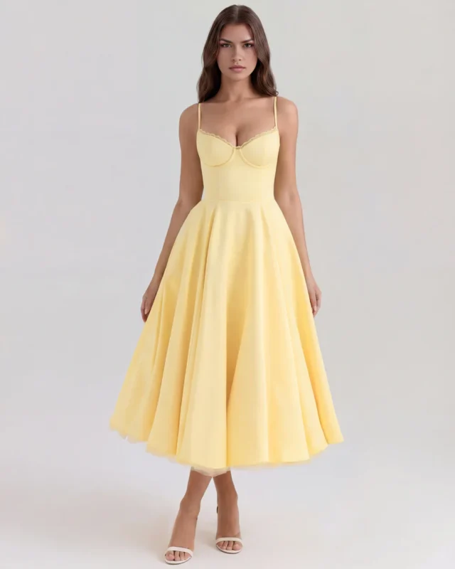 Front full-length view of the Selena midi tea dress in pastel butter yellow, showcasing the structured cupped corset bodice, delicate lace cup trim, and a voluminous flared A-line skirt.