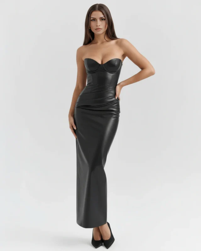 Front full-length portrait of the Victoria black midi dress, showcasing a structured strapless sweetheart neckline with defined underwire cups, an asymmetrical gathered hip overlay, and a sleek body-con ankle-length pencil skirt.