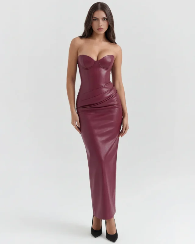 Balanced front portrait of the dark burgundy vegan leather strapless pencil gown, emphasizing the smooth torso compression and the statuesque ankle-grazing column silhouette.